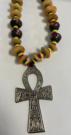 Ankh necklace cross jewelry . Comes attached with Ankh. Beaded necklace 12. 5 inches and with Ankh 4 inches long.Great for everyday wear. Don't delay order yours today. African Beaded Necklace, Ankh Necklace, Necklace African, African Necklace, Necklace Cross, African Beads, African Jewelry, Cross Jewelry, Unisex Jewelry