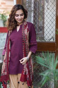 Tailored out of 100% premium Pashmina, Sumaira is a promise of toasty coziness and velvety soft skin feel. The sophisticated dark wine top features wooden buttons that add to its organic allure, while dainty Kantha work adds a touch of intricacy to the piece. The elongating V neckline and relaxed 3/4 sleeves boost its graceful beauty. Wine Top, Kantha Work, Wooden Buttons, Soft Skin, Kurti Designs, Skin So Soft