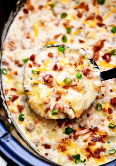 a ladle scooping some food out of the crock pot