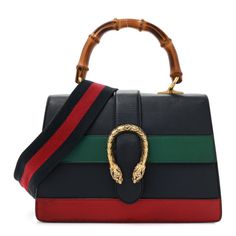 This is an authentic GUCCI Moon Calfskin Bamboo Web Medium Dionysus Top Handle Bag in Blue, Emerald, and Hibiscus Red. This bag is crafted of smooth blue calfskin leather with a green and red stripes across the front. The bag has a sturdy bamboo top handle, an optional blue and red striped canvas shoulder strap, and a prominent brass tiger head horseshoe closure. The flap opens to reveal a partitioned beige fabric interior with pockets. Gucci Handheld Bag With Detachable Handle, Designer Handheld Shoulder Bag With Bamboo Handle, Gucci Black Shoulder Bag With Bamboo Handle, Luxury Crossbody Bag With Bamboo Handle, Gucci Handheld Shoulder Bag With Detachable Handle, Gucci Rectangular Bag With Bamboo Handle, Gucci Bamboo Handle Rectangular Bag, Gucci Black Bag With Bamboo Handle, Black Gucci Bag With Bamboo Handle