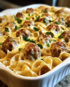 a casserole dish with meatballs and cheese