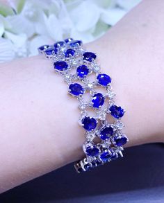 "A DREAM COMES TRUE! Gorgeous masterpiece! ONE OF A KIND Bracelet! Featuring 43 pieces of extra fine, SPARKLING CEYLON BLUE SAPPHIRES weighting a total of 33.10 carats... and 60 pieces of BIG SPARKLING, top-grade, F/VS, round Diamonds (2.90 carats in total). SET IN ONE-OF-A-KIND 18K Solid White Gold, meticulously designed and handcrafted BRACELET! A true heirloom piece that can transcend beyond times and eras.... BRAND NEW, HANDMADE BY OUR GOLDSMITHS! DAZZLING GENUINE CEYLON BLUE SAPPHIRE! Extre Royal Estate, Ceylon Blue Sapphire, Sparkle Bracelet, Bracelet Tennis, Wooden Bracelet, Blue Sapphire Diamond, White Bracelets, White Gold Bracelet, Handcrafted Bracelets