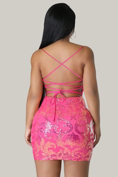 This Sequined V-neck Dress in a stunning, luxurious pink color features a sexy backless design with a zipper. The plain pattern is complemented by a cami style and spaghetti straps, creating an elegant and exclusive look. The sleeveless design and natural waistline accentuate the slim fit and pencil hemline, making it a must-have for any sophisticated wardrobe. Crafted from high-quality sequins and a slight stretch fabric, this dress is both luxurious and comfortable. 95% Polyester, 5% Elastane Glamorous Sleeveless Mini Dress With Lace-up Back, Glamorous Backless Dress With Lace-up Back, Pink V-neck Mini Dress For Prom, Pink Tie-back Backless Dress For Night Out, Pink Fitted Dress With Strappy Back, Bodycon V-neck Dress With Crisscross Straps, Pink Mini Dress With Lace-up Back, Party Backless Dress With Corset Back And Spaghetti Straps, Backless Party Dress With Corset Back And Spaghetti Straps