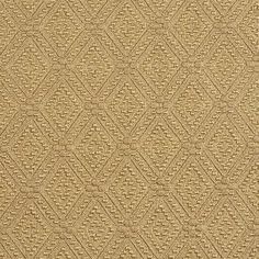 a tan rug with diamond shapes on it