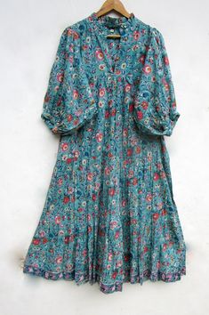 "ITEM DESCRIPTION teal green flower printed maxi dress - v neckline summer maxi dress - 3/4th sleeve with button maxi dress Features: 3/4th sleeve, V neck, Long dress Material: Cotton cambric Fabric: 100% cotton soft light weight ethnic print fabrics  Sleeve Length = 18 inch For more sizes & their measurement, please refer our below chart to understand the sizes variations available with us For your size requirement, please mention your size in seller note at the time of buying. SIZE MEASUREMENT  BUSTLENGTHSHOULDER XXS34 inch51 inch13.5 inch XS36 inch51 inch14 inch S38 inch51 inch14.5 inch M40 inch51 inch15 inch L42 inch51 inch16 inch XL44 inch51 inch16.5 inch 2XL46 inch51 inch17 inch 3XL48 inch51 inch18 inch   Company Return Policy:  Please write for more information to my email directly Cambric Fabric Dresses, Dress Design Pakistani, Crop Top Design, Vintage Clothes Patterns, V Neck Long Dress, Button Maxi Dress, Fab Dress, Crop Top Designs, Fashion Top Outfits