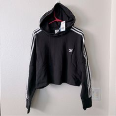 Adidas Black Noir Cropped Hoodie! Brand New! Size: Large Smoke Free, Pet Friendly Home. Feel Free To Ask Questions. Thank You! Black Tops With Double-lined Hood For Spring, Adidas Sweatshirt With Drawstring Hood For Spring, Adidas Hoodie With Drawstring Hood For Fall, Adidas Casual Hoodie With Three Stripes, Adidas Long Sleeve Hoodie For Fall, Adidas Cotton Hoodie For Spring, Adidas Black Sweatshirt For Fall, Casual Adidas Hoodie With Three Stripes, White Casual Hoodie With Three Stripes