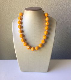 "The perfect pumpkin orange shade for Fall! Faceted acrylic orange beads create a chunky statement look for your favorite season. About 17 inches long with a 4 inch extender chain. Gold chain and lobster clasp. Earrings are a matching, single bead, 2\" drop fish hook style pierced earring. Can be worn to match the necklace or on their own! *Smoke and pet free home!* I ship 6 days a week! Thank you for browsing my store!" Dark Blue Jewelry, Blush Jewelry, Clasp Earrings, Blue Jewelry Set, Pink Statement Necklace, Blue Statement Necklace, Gray Necklace, Orange Necklace, Halloween Necklace