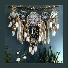 a wall hanging with dream catchers and lights