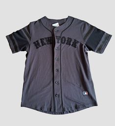 New York Baseball Shirt Condition: 9/10 (Like New Without Tags) Color: Grey Size: Small For more information do not hesitate to contact via messages. Casual College Baseball Jersey Short Sleeve, Casual Short Sleeve Baseball Jersey For College, Casual Short Sleeve College Baseball Jersey, Casual Short Sleeve Shirt For Baseball Season, Baseball Season Short Sleeve Shirt With Text Print, Casual Baseball Jersey With Graphic Print, Short Sleeve Shirt With Text Print For Baseball Season, Text Print Short Sleeve Shirt For Baseball Season, Short Sleeve Cotton Tops For Baseball Season