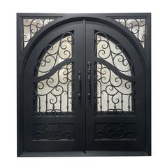 an ornate iron door with glass panels and wrought designs on the sides, in black