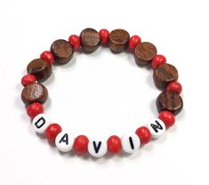 "Bracelet for Boys. Boys Wood beaded bracelet. These Personalized name bracelets make great Party Favors, Stocking Stuffers, Valentines, or easter basket fillers for Boys or girls. They're Hypoallergenic make with wood beads and acrylic letters. Available with Navy, Red, Lime, or Turquoise accent beads. Made on durable stretch cord. Sized by age. See Order info below. Upgraded gift packaging also available at the link below. Our standard free packaging is an organza drawstring bag and sparkly ti Bracelet For Boys, Bracelet Party, Wood Bead Bracelet, Easter Basket Fillers, Girl Scout Troop, Basket Fillers, Acrylic Letters, Turquoise Accents, Valentines For Boys