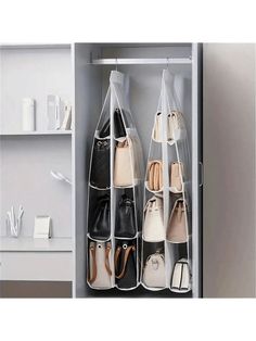 an organized closet with handbags and purses