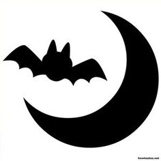 a bat sitting on top of a crescent