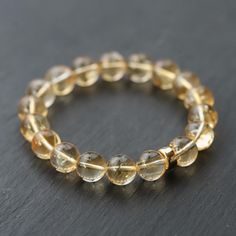 Want to save 15% off your first order? Sign up for our newsletter by visiting our website and filling out the pop up form. Receive a code by email, then send us that code through Etsy messages to save 15% off your ETSY order, sign up here: www.earthlyabundancejewelry.com  This gorgeous Citrine beaded bracelet contains high grade, smooth, and round 10mm Genuine Natural Citrine beads. It is a genuine citrine bracelet, UNHEATED with no treatment. Citrine: creativity, vitality, self-expression, opti How To Release Anger, Citrine Bracelet, Gemstone Properties, Citrine Beads, Rishikesh, Natural Citrine, Bead Bracelet, Jewelry Care, Jaipur