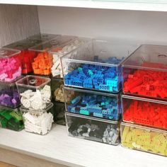 plastic containers filled with legos sitting on top of a counter