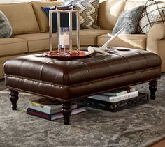 a living room filled with lots of furniture and pillows on top of a carpeted floor