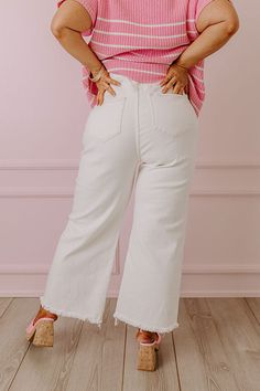 - These sweet jeans are perfectly stylish! - Stretchy denim - A waistline with belt loops, a hidden zip fly, and button closure - Functional front and back pockets - A relaxed silhouette that ends in unfinished ankle length hemlines with frayed detail Wide Leg Jeans With Frayed Hem For Day Out, High-rise White Jeans With Belt Loops, High Rise White Jeans With Belt Loops, White High Rise Jeans With Belt Loops, Casual Cream Flare Jeans For Spring, Casual Cream Cotton Flare Jeans, White High Waist Flare Jeans With Frayed Hem, White High-waist Flare Jeans With Frayed Hem, Straight Leg Bottoms With Frayed Hem For Day Out