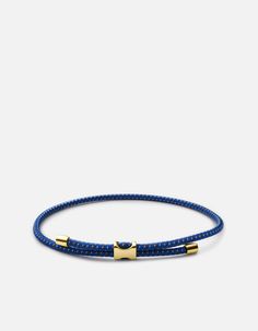 The hardware inspired men's Orson Pull Rope Bracelet features a hand-casted gold vermeil flat bead strung onto a bungee cord. Adjustable in size for an easy to wear staple piece.[tab]Specifications[/tab]Base Metal: Sterling SilverPlating: Polished 14k Yellow GoldMaterial: Nylon Bungee Rope/Gold Vermeil PartsDimensions: Closure: W: 6.7mm x H: 3.4mm, Cap: 3.6mmGauge: 2mm Mens Rope Bracelet, Boy Flat Bead Bracelet, Men’s Bracelet, Bday List, Gold Pinky Ring, Bungee Cord, Men Jewelry, Stylish Watches, Wrist Cuffs