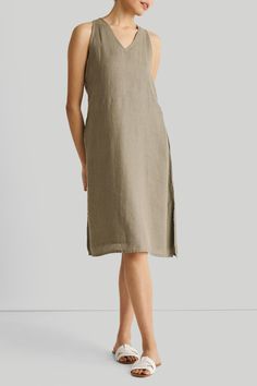 Introducing our Hemp V-Neck Straight Dress - an epitome of effortless elegance and minimalist chic. This midi-dress embodies modern sophistication with its clean lines and contemporary cut, embracing the essence of simplicity. Designed for versatility, it's a summer essential, perfect for various occasions. Its A-line fit offers comfort and style, while the V-neck and in-cut sleeves add a touch of allure. This stylish dress is complemented by functional pockets on both sides for practicality. Wa Leaves Dress, Reading Tea Leaves, Stylish Midi Dress, Tea Reading, Minimalist Chic, Straight Dress, Green Midi Dress, Sustainable Fabrics, Tea Leaves