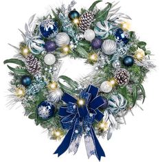 a christmas wreath with blue and white ornaments on it, lit up at the base