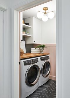 a washer and dryer in a small room