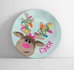 a plate with a reindeer face on it and the word grace written in bright lights