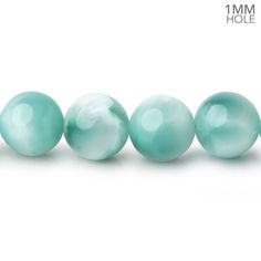 four pearls are lined up in a row on a white background with the words, 1 mm hole