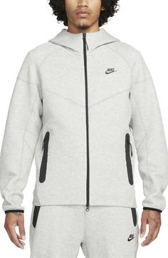 Lightweight Tech Fleece brings softness and warmth without added bulk to a layerable hoodie with zippered pockets for warming hands or holding essentials. 27" length (size medium) Fixed hood 53% cotton, 47% polyester Machine wash, tumble dry Imported Nike Grey Tech, Grey Nike Hoodie Mens, Nike Tech Fleece Hoodie, Nike Sportswear Mens, Nike Sportswear Tech Fleece, Tech Fleece Hoodie, Windrunner Jacket, Zip Design, Nike Tech Fleece