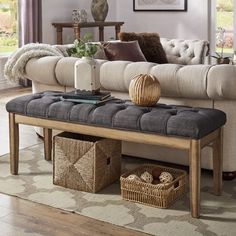 a living room scene with focus on the couch and coffee table in the foreground