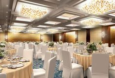 a banquet hall with tables and white chairs