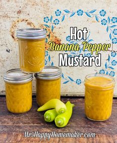 four jars of hot banana pepper mustard next to bananas