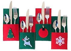 a group of forks and spoons with christmas decorations on them, sitting in front of a free shipping box