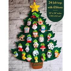 a christmas tree made out of felt with decorations on it and the words, 24 felt toys with ribbons