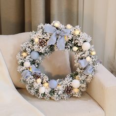 a christmas wreath sitting on top of a couch