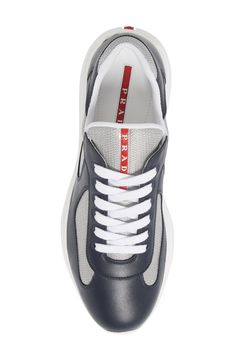 Made from leather and breathable mesh, this low-top sneaker was originally designed for the Luna Rossa sailing team to wear during the 2000 America's Cup. Style Name:Prada America's Cup Bike Low Top Sneaker (Men). Style Number: 6271515. Prada Americas Cup Sneakers Outfit Men, Luxury Low-top Sporty Men's Shoes, Luxury Sporty Low-top Men's Shoes, Luxury Low-top Patent Leather Sneakers, Luxury Italian Lace-up Shoes For Men, Sneak Attack, America's Cup, Shoes Prada, Mens Designer Shoes