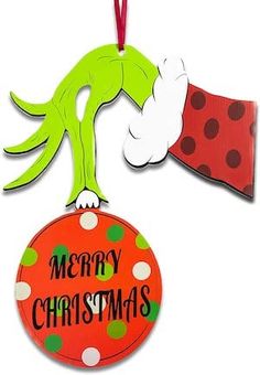 a christmas ornament hanging from a red and green polka dot ribbon with the words merry christmas on it