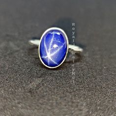 Star Sapphire Ring, Ring for Women, 925 Solid Sterling Silver Ring, Blue Sapphire Ring, Statement Ring, Gemstone Ring, Christmas Gift Gemstone details: Shape: Oval Stone: Star Sapphire Metal: Solid silver Stone Color: Blue Add this beautiful Ring in your accessories to make you feel unique. This ring have 925 stamp and you will receive a ring like the one in the picture. You can choose any size you want from drop down menu. We Accept Custom Order and Bulk Order Also, Feel free to contact me for Celestial Style Sapphire Ring In Sterling Silver, Celestial Sterling Silver Sapphire Promise Ring, Star-shaped Gemstone Rings For Gifts, Celestial Sapphire Birthstone Ring As Gift, Celestial Sapphire Ring In Sterling Silver, Sterling Silver Sapphire Star Jewelry, Celestial Sapphire Sterling Silver Rings, Celestial Style Sapphire Ring As A Gift, Celestial Sterling Silver Gemstone Rings