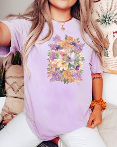 This beautiful softly colored oversized vintage style floral tee shirt will be perfect any day of the year! Comfort Colors introduces its garment-dyed t-shirt; a fully customizable tee made 100% with ring-spun cotton. The soft-washed, garment-dyed fabric brings extra coziness to your wardrobe while the relaxed fit makes it an excellent daily choice. The double-needle stitching throughout the tee makes it highly durable while the lack of side-seams helps the shirt retain its tubular shape. .: 100% ring-spun cotton .: Medium fabric (6.1 oz/yd² (206.8 g/m .: Relaxed fit .: Sewn-in twill label Genderfluid Flag, Plant Graphic, Vintage Floral Shirt, Genderfluid Pride, Spring Tees, Vintage Tee Shirts, Shirt Detail, Floral Tee, Flag Colors