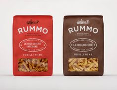 two bags of pasta next to each other on a white surface with the words rummo written in italian