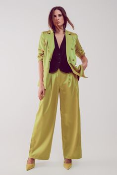 Made in Italy, these beautiful satin wide leg pants offer that fashionable tailored look that is trending strong this season. These pants boast of a high waist, wide legs, belt loops, functional side pockets, a zip fastening, and of glossy satin-style acid lime green fabric that is made from 100% Polyester. Consider wearing them with our Satin Tailred Double Breasted Suit Blazer in Lime. The model is 5’8” with measurements of 33-24-35 and is wearing a size small. The S-M-L sizing equates to US s Jean Beige, Satin Style, Satin Blazer, Shiny Fabric, Glam Looks, Tailored Blazer, Pleated Pants, Green Satin, Double Breasted Blazer