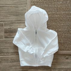 Classic White Zip Up Hoodie, No Tags But Brand New Hooded Outerwear With Drawstring Hood For Playtime, Fall Outerwear With Drawstring Hood For Playtime, Cotton Outerwear With Adjustable Hood For Playtime, Adjustable Hood Hoodie For Playtime In Fall, Basic Hooded Outerwear With Ribbed Cuffs, Cotton Playtime Hoodie Outerwear, White Fleece Hooded Jacket With Adjustable Hood, Cotton Hoodie Sweatshirt For Playtime, Cotton Hoodie With Adjustable Hood For Playtime