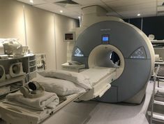 a hospital room with an mri machine in it