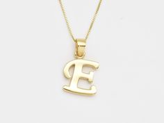 Gold Letter E Pendant made of Gold Vermeil ☞ thickest 18k Gold Plating on top of Solid 925 Sterling Silver ☞ made to last.  Full Letters Collection (Silver): www.etsy.com/listing/1602103036 Full Letters Collection (Gold): www.etsy.com/listing/1604371554 Full Letters COllection (White Gold): www.etsy.com/listing/1618553513 Details : ♥ Each item comes in a cute GIFT BOX ✓ ♥ GUARANTEE on the materials ✓ ♥ Pure Solid 925 Sterling Silver ☞ Silver Hallmark on each piece ♕ ♥ Gold Vermeil: Thickest 3 Mi Letter E Necklace, E Necklace, E Letter, Initial E, Letter Necklace Initials, Alphabet Pendant, Cute Gift Boxes, Gold Letter, Gold Necklace Set