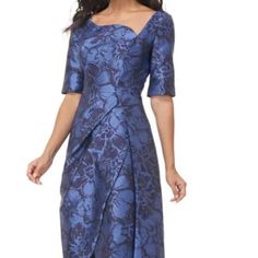 A Sculptural Curve And A Tulip Hem Create A Gorgeous Geometry In This Flower-Decked Dress Shaded In Lustrous Blue Hues. Hidden Back-Zip Closure Asymmetric Neck Elbow-Length Sleeves Lined 80% Polyester, 20% Nylon .Bust: 36" Waist: 28" Hips: 40" **New Without Tags** Formal Dress With Fitted Bodice And Asymmetrical Hem, Blue Floral Print Dress With Asymmetrical Hem, Blue Dress With Asymmetrical Neckline For Formal Occasions, Blue Asymmetrical Hem Dress With Floral Print, Jacquard Midi-length Dress, Elegant Jacquard Midi Dress With Floral Print, Evening Fitted Jacquard Dress, Blue Dresses With Asymmetrical Neckline, Blue Midi Dress With Asymmetrical Floral Print Hem