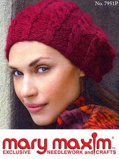 a woman wearing a red knitted hat with the name mary moxm on it