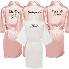 three bridesmaid robes in pink and white, one with the word mother of the bride on it