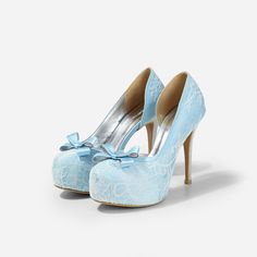 Lady Bella is a pair of custom made shoes in sweet baby blue satin. This pair of wedding heels features silky satin fabric with ivory white lace overlay. The front of this bridal heel features a dainty bow and the 4.5 inch heel of this bridal shoe is finished in silver glitter fabric. This pair of shoes is made using satin, glitter, lace, PU and other synthetic materials. They can be customized in different heel heights, colors and styles. They come with 0.5 inch elevated platform front. CUSTOMI Satin High Heel Wedding Shoes, High Heel Satin Wedding Shoes, Light Blue Round Toe Evening Wedding Shoes, Elegant Light Blue Wedding Shoes For Formal Occasion, Light Blue High Heels For Wedding, Light Blue High Heel Wedding Heels, Elegant Light Blue Closed Toe Wedding Shoes, Light Blue Closed Toe Heels For Wedding, Light Blue Round Toe Heels For Wedding