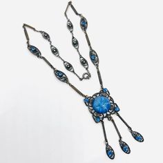 a long necklace with blue beads on it