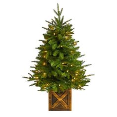 Create your own mini Christmas wonderland and rock around with this Artificial Christmas Tree. Incredibly lifelike textured branches mimic real evergreens for a sturdy construction. This pre-lit artificial Christmas tree comes with 50 clear lights and has upward-sloping branches  allowing you to decorate with mini-ornaments of your choice easily. Standing 3ft. from a decorative planter, this tree requires zero maintenance, just some fluffing and shaping thats easy with the bendable branches! Dec Faux Christmas Trees, Warm White Lights, Fir Christmas Tree, Cone Trees, Pre Lit Christmas Tree, Mini Ornaments, Christmas Greenery, White Lights, Decorative Planters