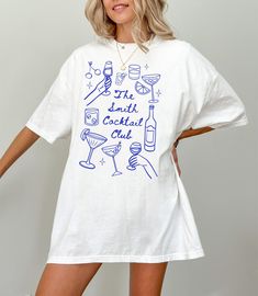 This trendy matching cocktail club shirt is perfect for your bachelorette party (or any other celebration)! The comfort colors shirt is super comfy and soft, and has a very cool aesthetic style This shirt has a relaxed fit. For a more oversized look size up 1/2 sizes from your normal size.  Please check the product dimensions in the photo section, to confirm the right size for you.    CUSTOMIZATION: If you would like this design on another medium please feel free to reach out to me and let me kn Friend Group Sweatshirts, Trendy Summer T-shirt For Bachelorette Party, Summer Crew Neck Tops For Bachelorette Party, Crew Neck Tops For Bachelorette Party In Summer, Casual Graphic T-shirt For Bachelorette Party, Summer Club T-shirt With Crew Neck, Casual Graphic Print T-shirt For Bachelorette Party, Spring Club T-shirt With Crew Neck, Casual Short Sleeve T-shirt For Bachelorette Party